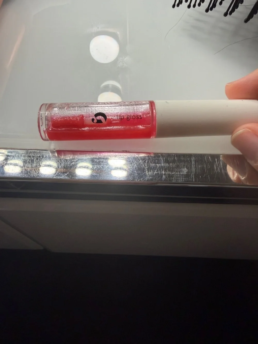 Glossier red lipgloss